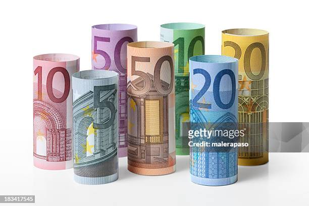 rolled up euro banknotes - euro coin stock pictures, royalty-free photos & images