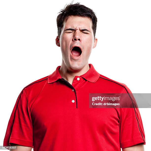 man with red shirt and dark hair yawning - man open mouth stock pictures, royalty-free photos & images