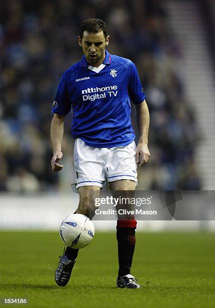 Kevin Muscat of Rangers runs with the ball during the Bank of Scotland Scottish Premier League match between Rangers and Dundee United held on...