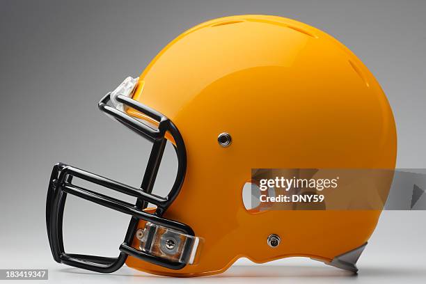 football helmet - yellow football helmet stock pictures, royalty-free photos & images
