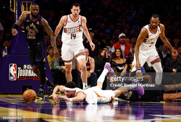 Devin Booker of the Phoenix Suns dives for the ball against Jaxson Hayes of the Los Angeles Lakers in the first half during the 2023 NBA In-Season...