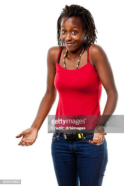 shrugging young woman - girl in black jeans stockfoto's en -beelden