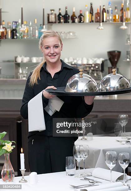 waitress holding serving tray in restaurant - cloche stock pictures, royalty-free photos & images