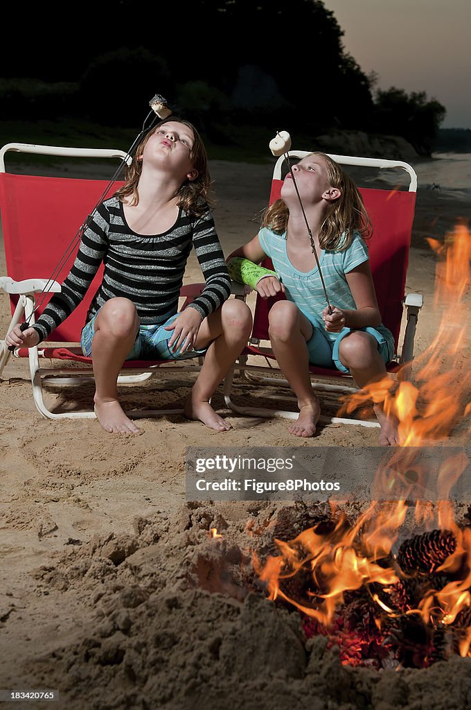 Girls roasting marshmallows