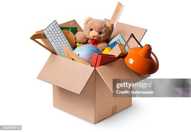 moving house. cardboard box with various objects. - gevuld stockfoto's en -beelden