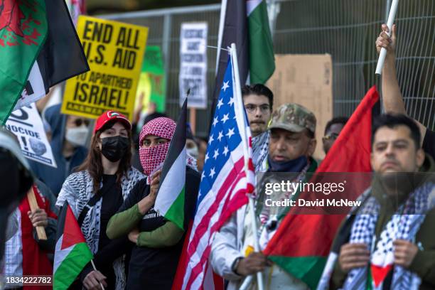 Protesters denounce the Biden administration's support of Israel, which has killed thousands of Palestinian civilians so far in its war against Hamas...