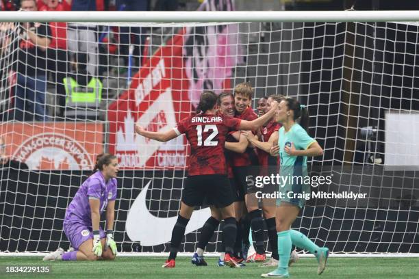 Quinn of Canada reacts with teammates after scoring a goal during the first half against Australia at BC Place on December 05, 2023 in Vancouver,...