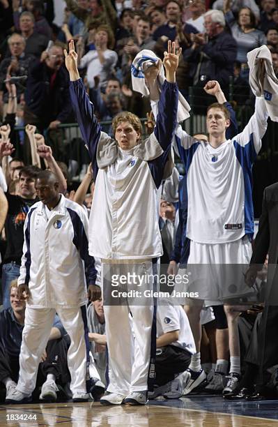 Avery Johnson, Dirk Nowitzki and Shawn Bradley of the Dallas Mavericks celebrate during the NBA game against the San Antonio Spurs at the American...