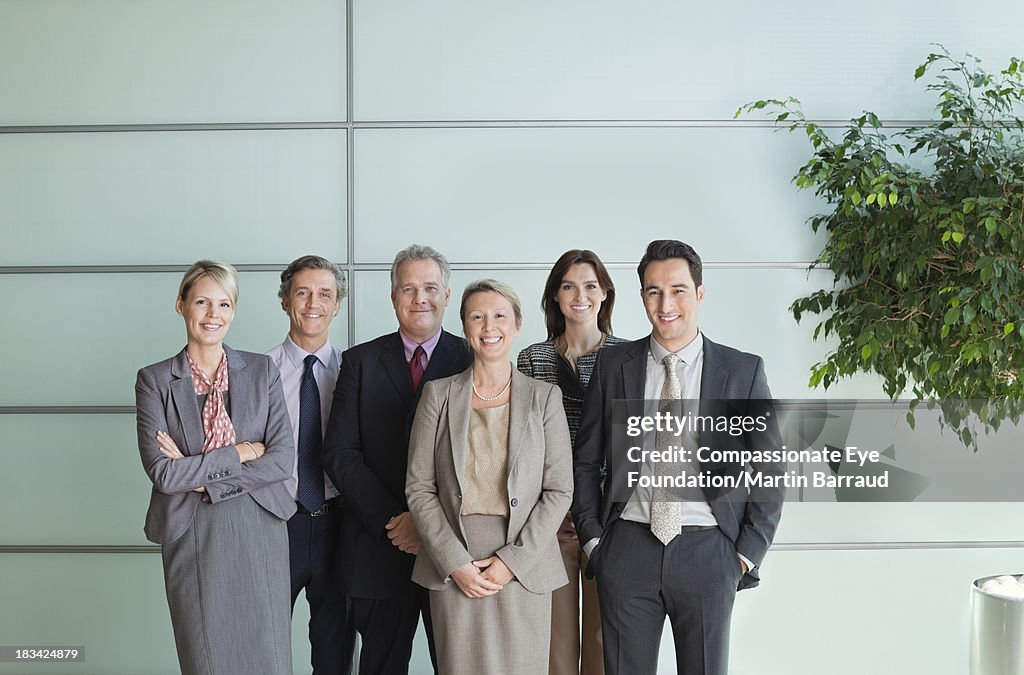 Smiling business people in lobby