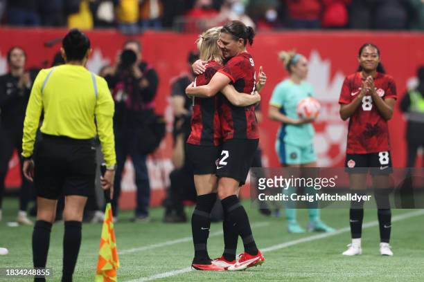 Christine Sinclair of Canada hugs Sophie Schmidt of Canada during the second half against Australia at BC Place on December 05, 2023 in Vancouver,...