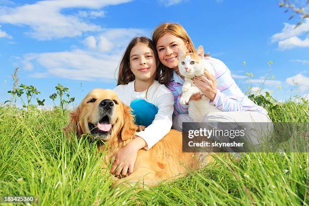 mother and daughter are enjoying outdoor with pets - cat spring bildbanksfoton och bilder