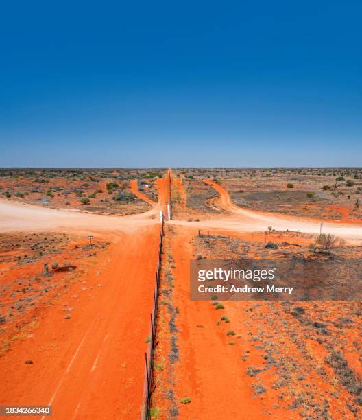 dingo or dog fence, state border outback australia - sturt national park stock pictures, royalty-free photos & images