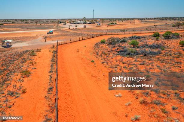 cameron corner and dingo fence outback australia - driving car australia road copy space sunlight travel destinations colour image day getting stock pictures, royalty-free photos & images