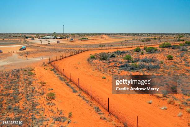 cameron corner and dingo fence outback australia - driving car australia road copy space sunlight travel destinations colour image day getting stock pictures, royalty-free photos & images