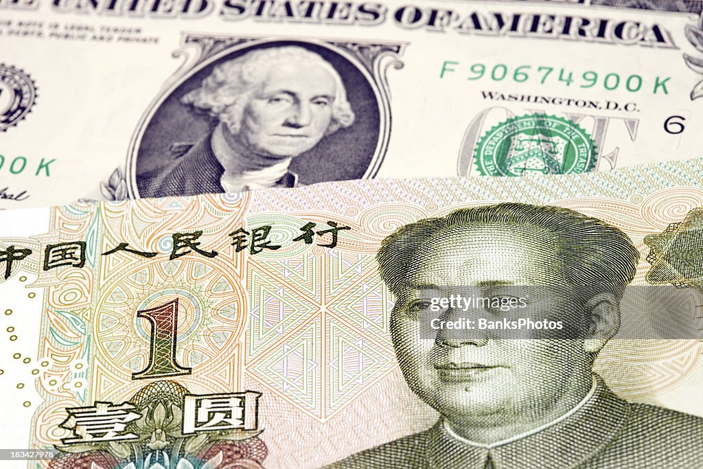 Chinese One Yuan Rests On Top Of Us Dollar High-Res Stock Photo - Getty ...