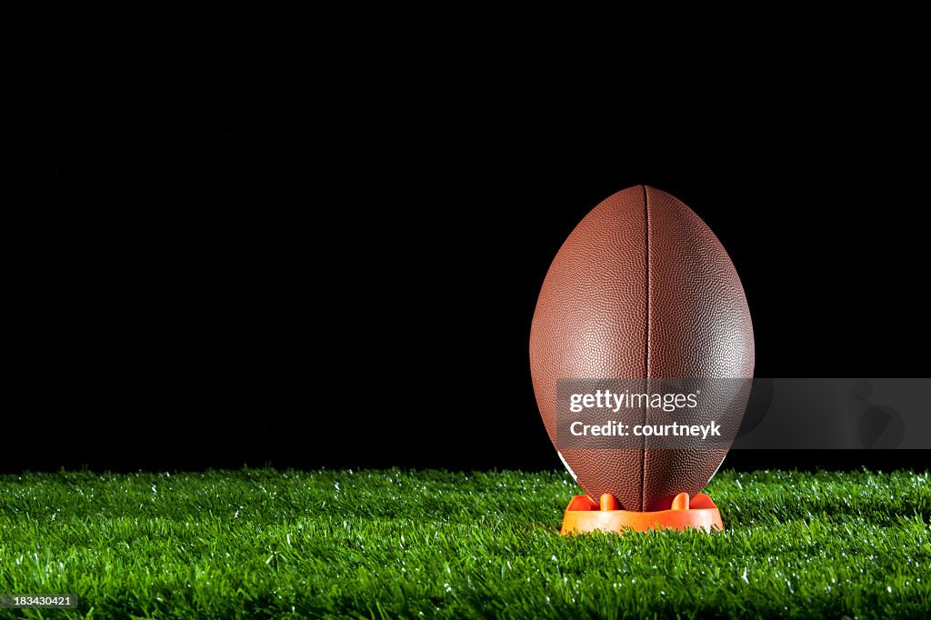 Gridiron ball standing on a tee