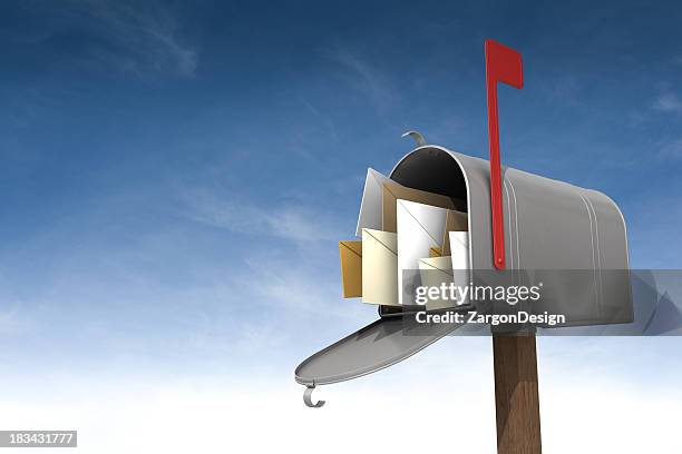 a metal mailbox filled with letters against the sky - letterbox stock pictures, royalty-free photos & images