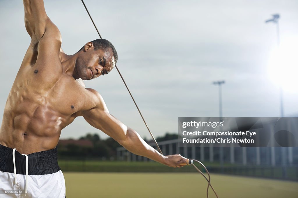 Man working out with a jump rope