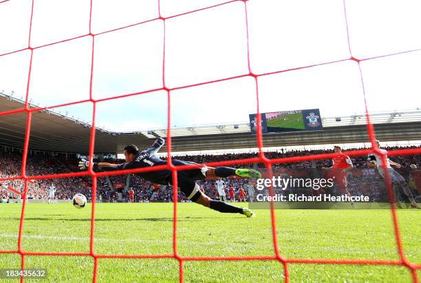 Jay Rodriguez of Southampton shoots past goalkeeper Michel Vorm of Swansea City to score their second goal during the Barclays Premier League match...