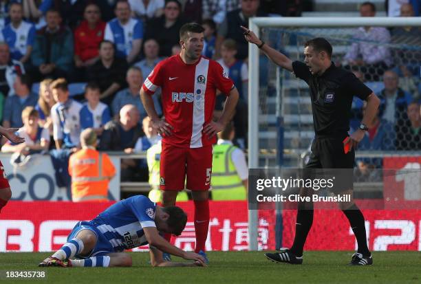 Grant Hanley of Blackburn Rovers is sent off by referee Mr Stuart Attwell during the Sky Bet Championship match between Wigan Athletic and Blackburn...