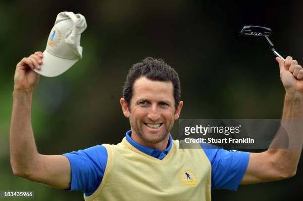 Gregory Bourdy of the European team celebrates winning his match and becoming the first player ever to be unbeaten in the Seve Trophy during the...