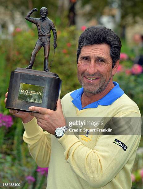 European team captain Jose Maria Olazabal holds the trophy after winning the final days singles matches at the Seve Trophy at Golf de...