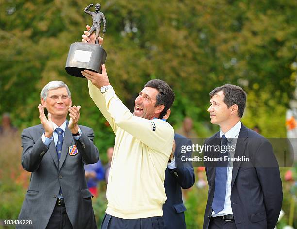 European team captain Jose Maria Olazabal holds the trophy after winning the final days singles matches at the Seve Trophy at Golf de...
