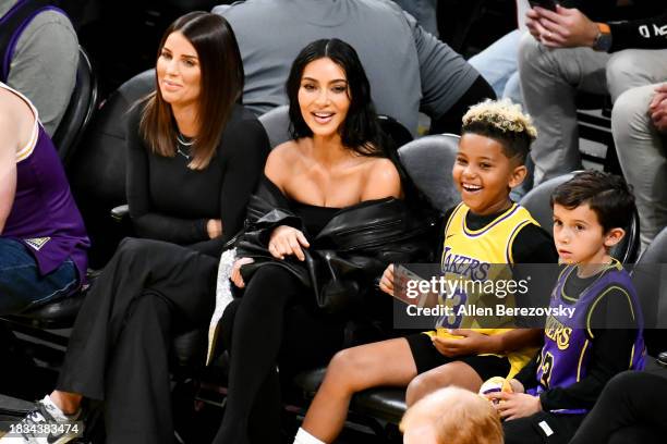 Kim Kardashian and Saint West attend a basketball game between the Los Angeles Lakers and the Phoenix Suns at Crypto.com Arena on December 05, 2023...