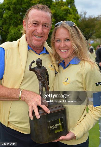 Miguel Angel Jimenez of the European team celebrate with the trophy and his girlfriend Susanne Styblo after winning the Seve Trophy at Golf de...
