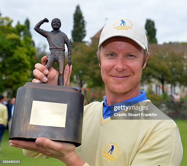 Mikko Ilonen of the European team celebrate with the trophy after winning the Seve Trophy at Golf de Saint-Nom-la-Breteche on October 5, 2013 in...