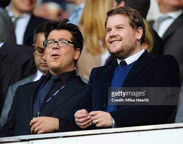 Comedian Michael McIntyre and actor James Corden enjoy the action during the Barclays Premier League match between Tottenham Hotspur and West Ham...