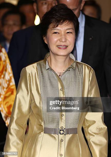 Park Geun Hye, president of South Korea, arrives at the Asia-Pacific Economic Cooperation CEO Summit in Nusa Dua, Bali, Indonesia, on Sunday, Oct. 6,...