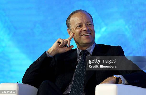Chris Viehbacher, chief executive officer of Sanofi, smiles during a panel discussion at the Asia-Pacific Economic Cooperation CEO Summit in Nusa...