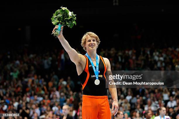 Epke Zonderland of the Netherlands celebrates with the gold medal after winning the Horizontal Bar Final on Day Seven of the Artistic Gymnastics...