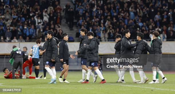 Kashiwa Reysol players look downcast after a penalty shootout loss to Kawasaki Frontale in the Emperor's Cup football final on Dec. 9 at Tokyo's...