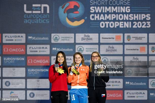 Thea Blomsterberg of Denmark, silver, Tes Schouten of Netherlands, gold, Kristyna Horska of Czechia, bronze show the medals after competing in the...