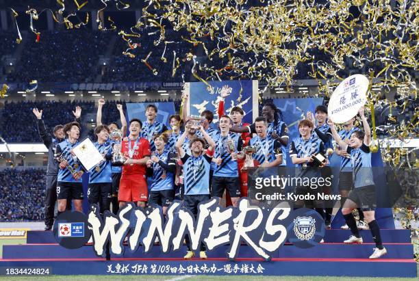 Kawasaki Frontale players celebrate after the team's victory over Kashiwa Reysol in the Emperor's Cup football final on Dec. 9 at Tokyo's National...