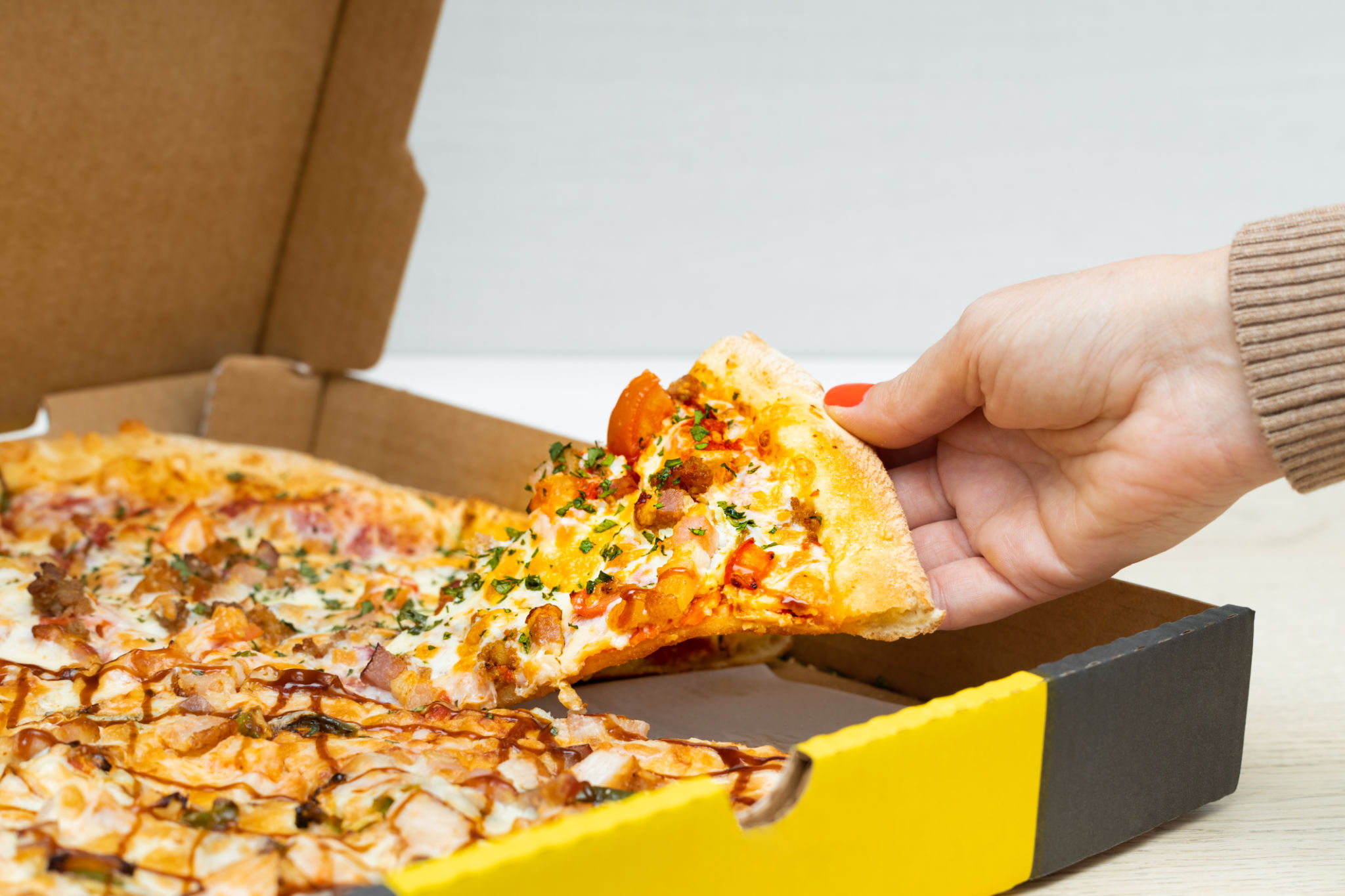 serving pizza