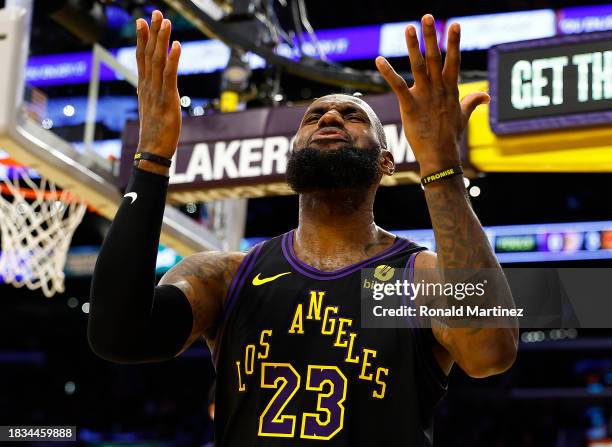 LeBron James of the Los Angeles Lakers reacts after being fouled against the Phoenix Suns in the second half during the 2023 NBA In-Season Tournament...