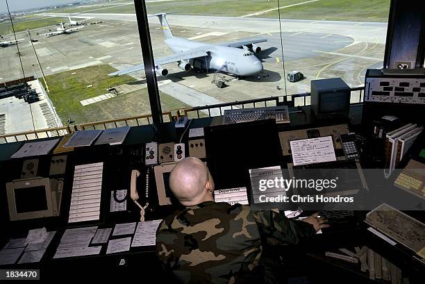 Senior Airman Miles McClure talks to pilots from the air traffic control tower March 7, 2003 at Incirlik Air Force Base in Turkey. Activity at...