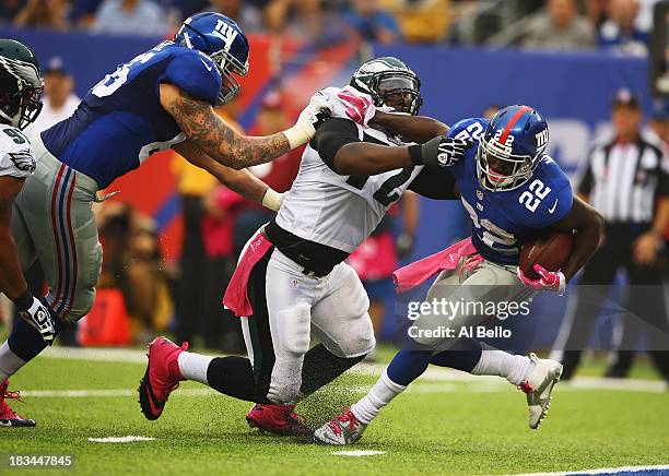 David Wilson of the New York Giants is tackled on his own goal line by Cedric Thornton of the Philadelphia Eagles in the second quarter during their...