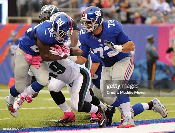 David Wilson of the New York Giants jumps into the end zone to score a touchdown against the Philadelphia Eagles at MetLife Stadium on October 6,...