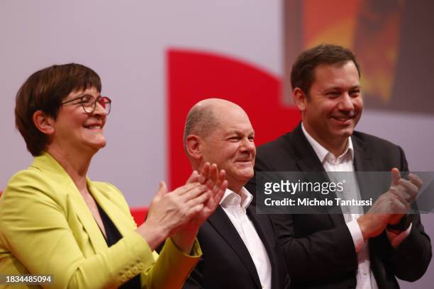 Saskia Esken and Lars Klingbeil, co-chairs of the German Social Democrats greet German Chancellor, Olaf Scholz after he speaks at the SPD federal...