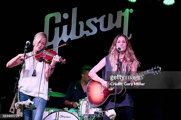 Martie Maguire and Emily Robison of Court Yard Hounds perform at The Gibson Guitar Texas Showroom on October 5, 2013 in Austin, Texas.