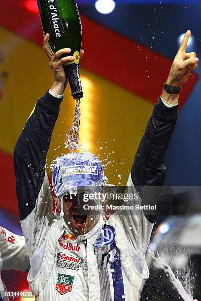 Sebastien Ogier of France celebrate his World Rally Championship Title in the final podium during Day Three of the WRC France on October 6, 2013 in...