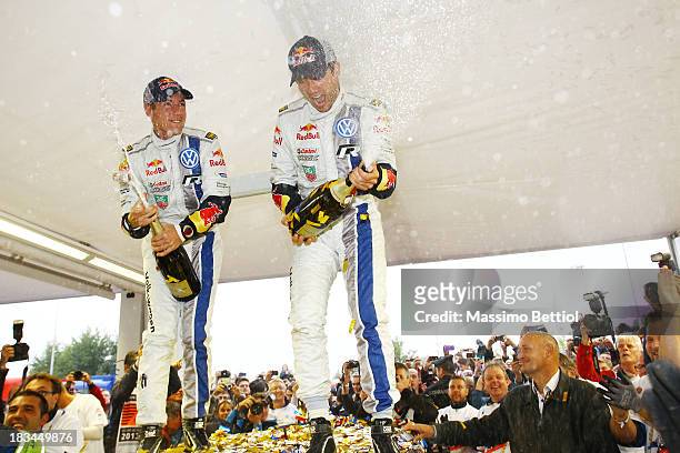 Sebastien Ogier of France and Julien Ingrassia of France celebrate their World Rally Championship Title in the final service park during Day Three of...