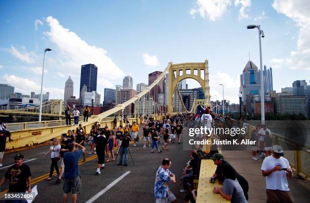 Fans walk over the Roberto Clemente Bridge towards PNC Park before Game Three of the National League Division Series between the Pittsburgh Pirates...