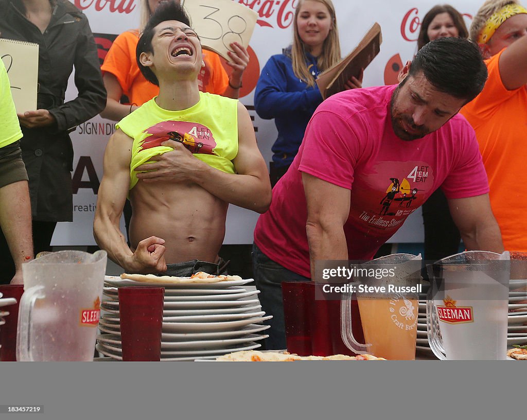 Takeru Kobayashi defends his pizza eating title at Pie Wood Fired Pizza Joint