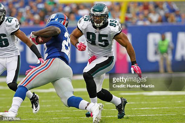 Mychal Kendricks of the Philadelphia Eagles pursues David Wilson of the New York Giants during a game on October 6, 2013 at MetLife Stadium in East...