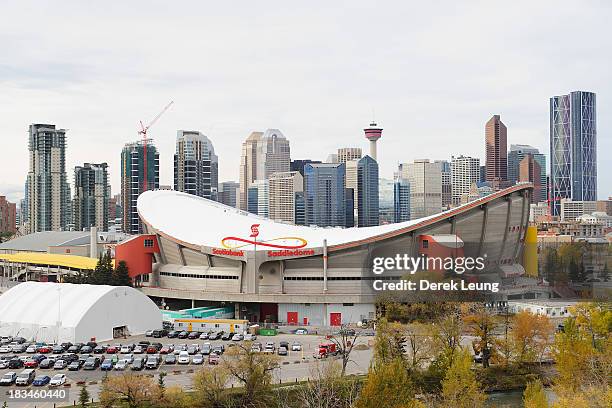 General view of the exterior of the Scotiabank Saddledome with the Calgary skyline behind prior to the Flames' home opening NHL game against the...